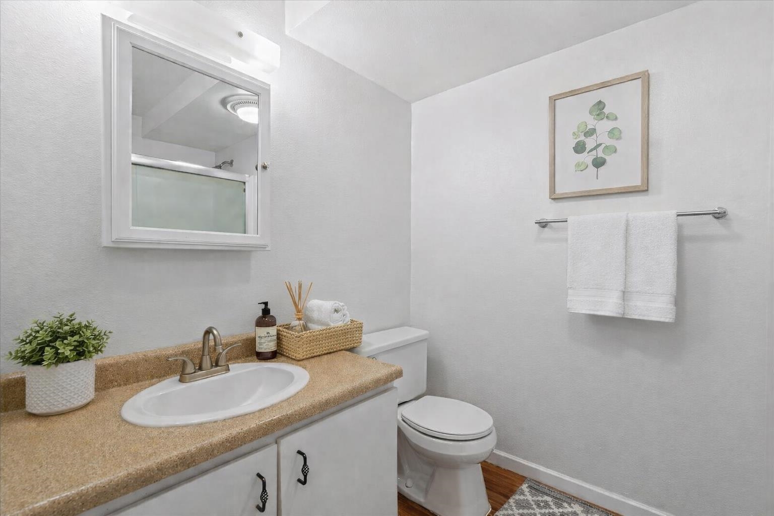 2747 South Kihei Road, Unit A107 Kihei, HI 96753 - Photo 5 of 46 a bathroom with a granite countertop toilet sink and mirror