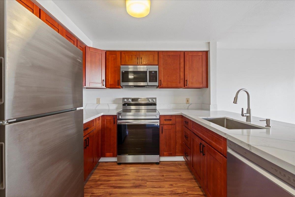 2747 South Kihei Road, Unit A107 Kihei, HI 96753 - Photo 6 of 46 a kitchen with stainless steel appliances granite countertop a sink stove and refrigerator