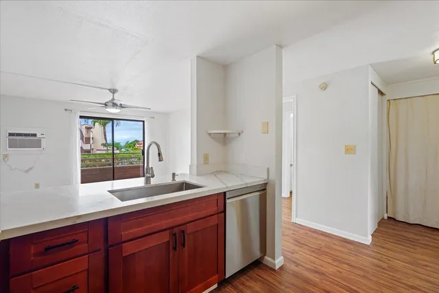 a kitchen with a sink and wooden cabinets