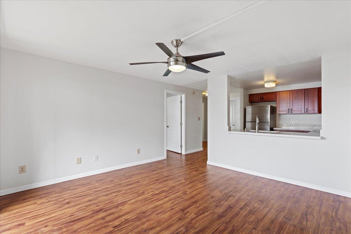 2747 South Kihei Road, Unit A107 Kihei, HI 96753 - Photo 9 of 46 a view of an empty room with window and wooden floor