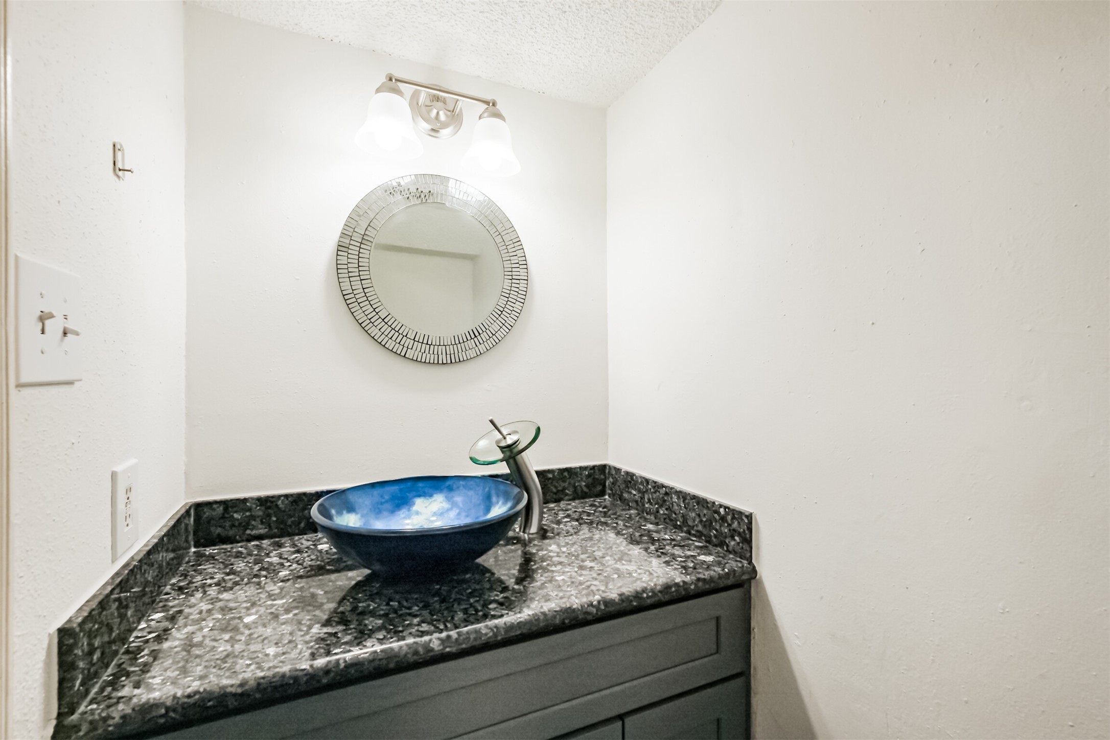 3100 Jeanetta Street, Unit 1305 Houston, TX 77063 - Photo 11 of 21 a bathroom with a granite countertop sink and a mirror