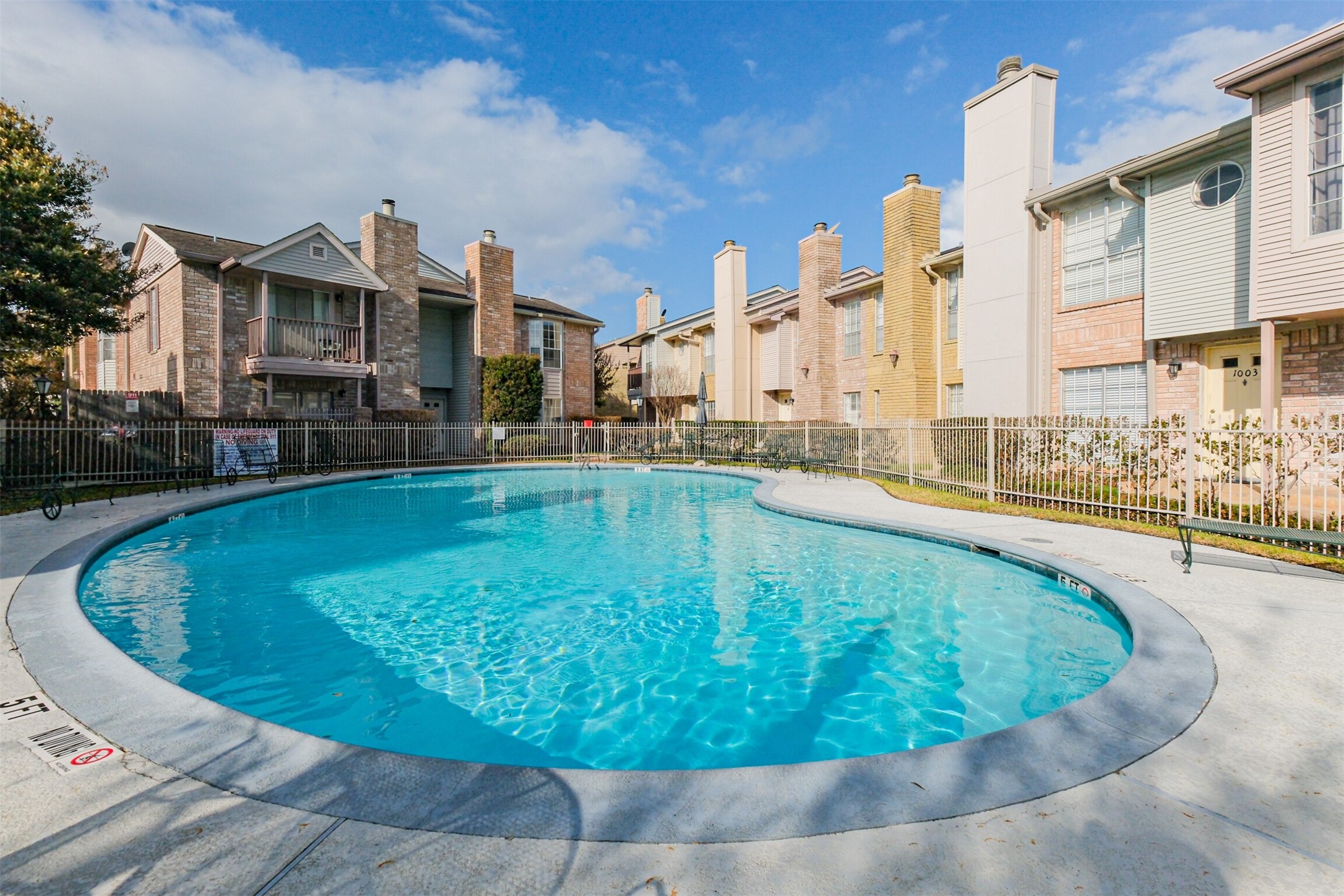 3100 Jeanetta Street, Unit 1305 Houston, TX 77063 - Photo 19 of 21 a view of a swimming pool with outdoor seating