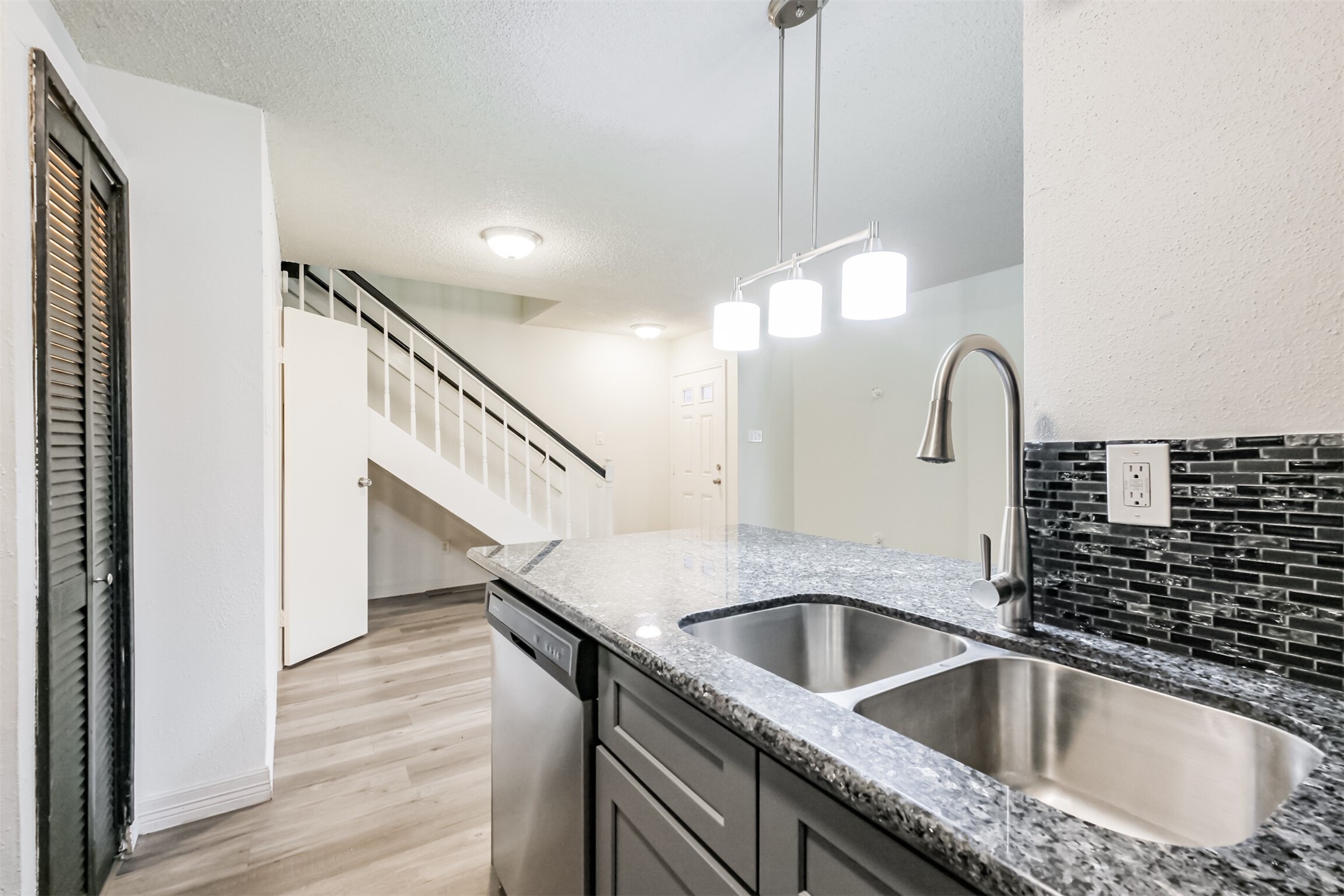 3100 Jeanetta Street, Unit 1305 Houston, TX 77063 - Photo 8 of 21 a kitchen with a sink and a potted plant