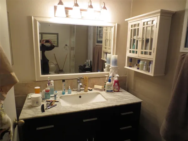 a bathroom with a sink double vanity and a mirror