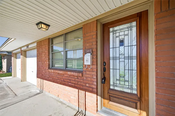 a front view of a house with a large window