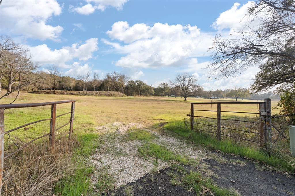 223 West Gaithings Covington, TX 76636 - Photo 20 of 22 View of green lawn featuring a view of countryside