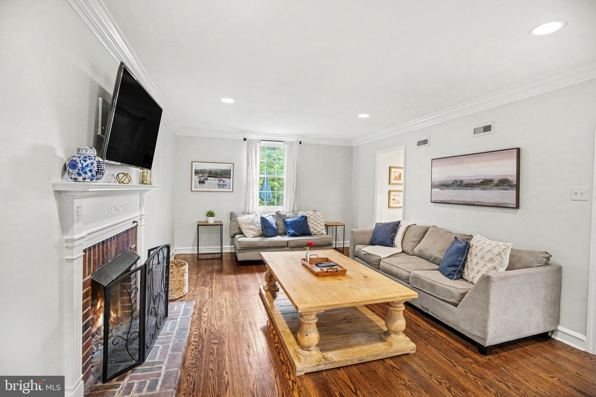 235 Hopkins Road Haddonfield, NJ 08033 - Photo 14 of 47 a living room with fireplace furniture and a flat screen tv