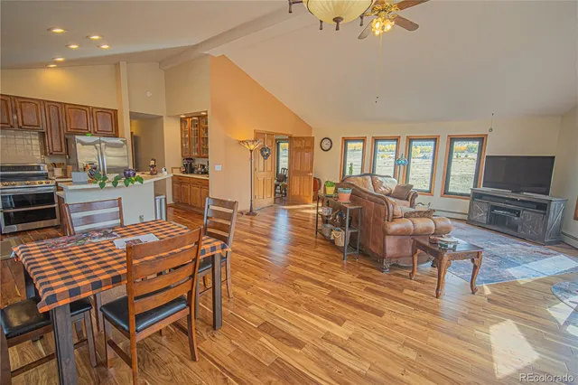 a view of a dining room with furniture window and wooden floor