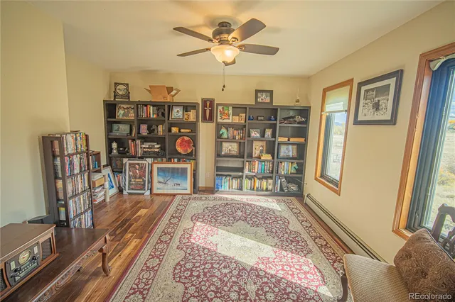 a bedroom with furniture and a book shelf
