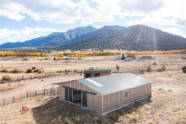 a view of a terrace with a lake and mountain view