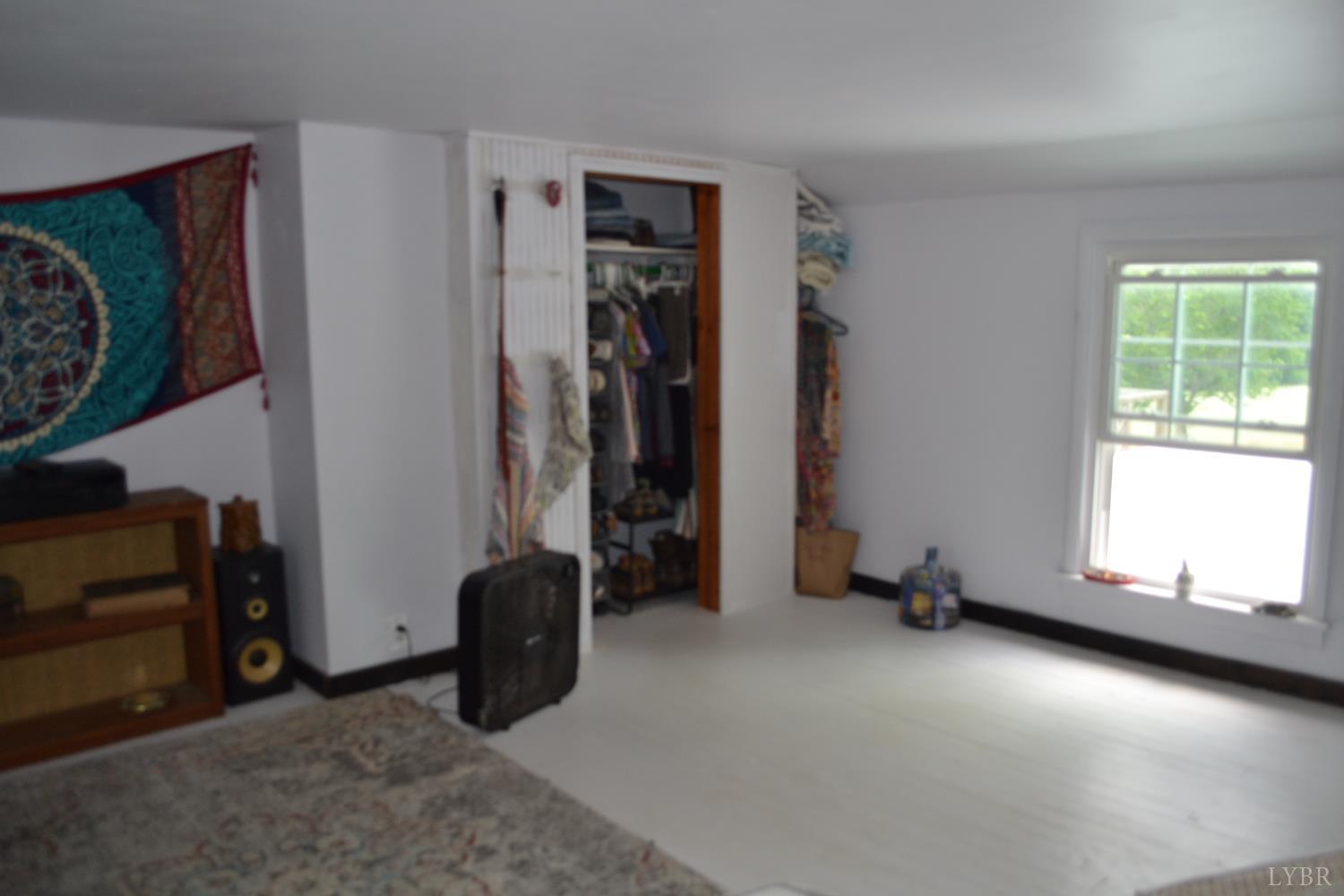 6387 Red House Road Rustburg, VA 24588 - Photo 27 of 38 an empty room with windows and closet