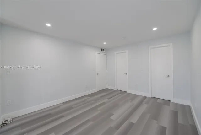 a bathroom with a sink toilet and mirror