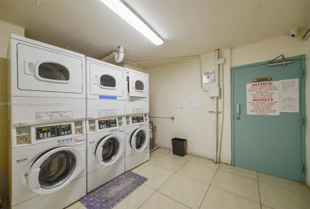 a view of a lake with a big yard and large trees