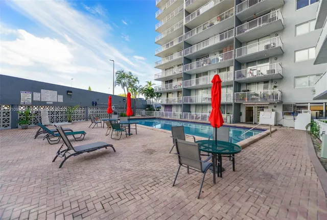 a room with lots of books and a large window