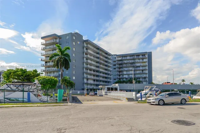 a building view with swimming pool and outdoor seating