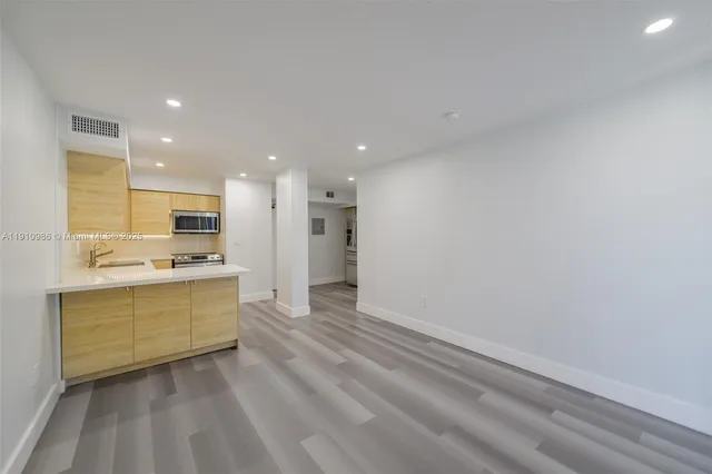 a view of kitchen with wooden floor