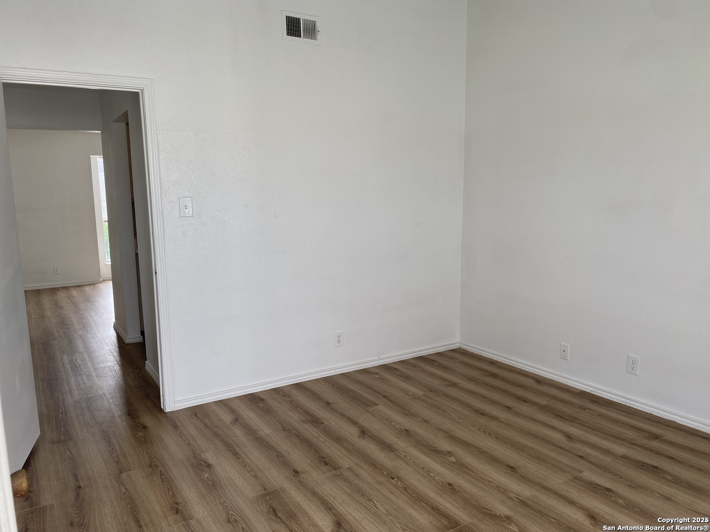 4949 Hamilton Wolfe Road, Unit 5201 San Antonio, TX 78229 - Photo 13 of 29 wooden floor in an empty room