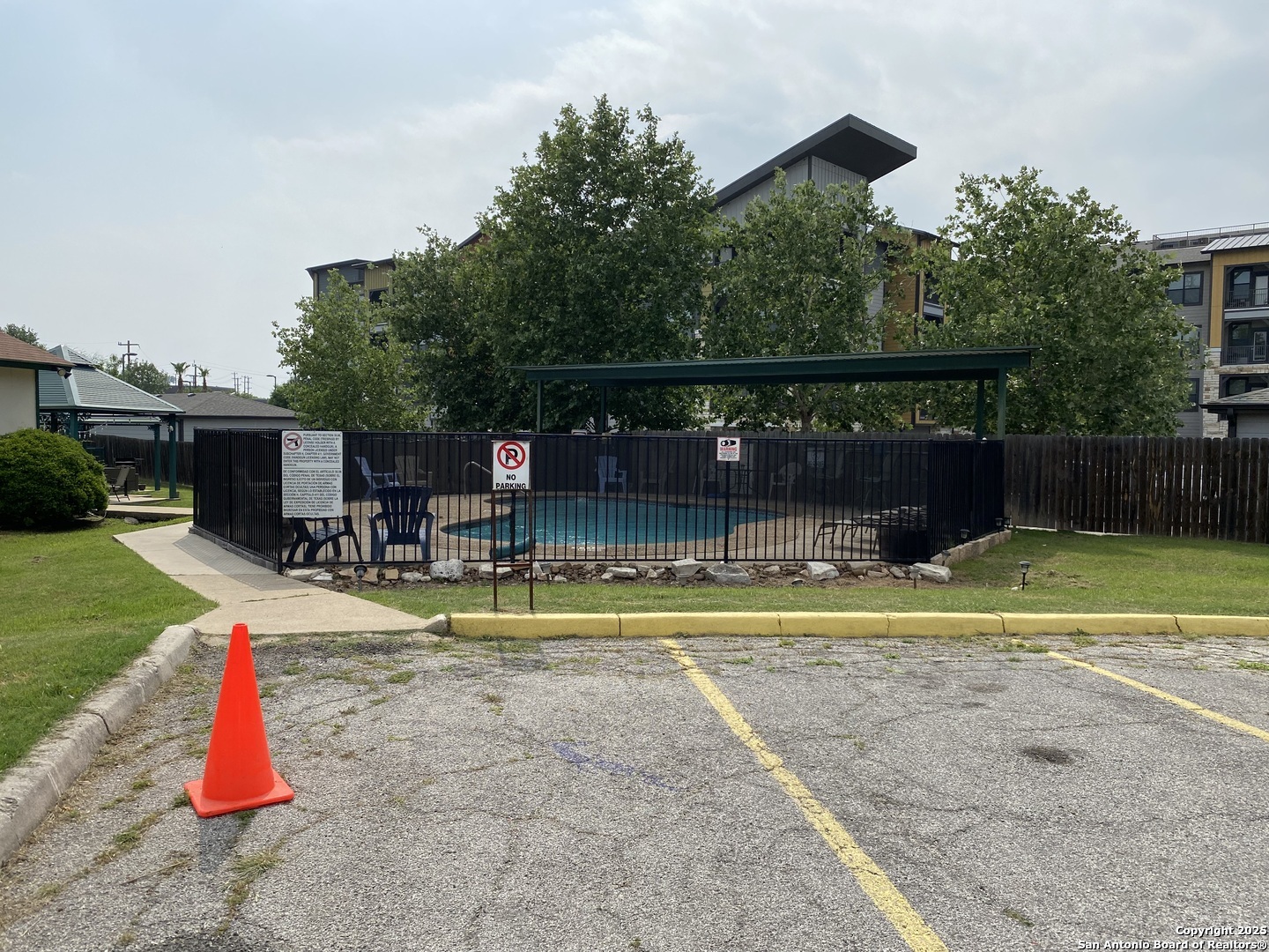 4949 Hamilton Wolfe Road, Unit 5201 San Antonio, TX 78229 - Photo 26 of 29 a view of a backyard with swimming pool and sitting area
