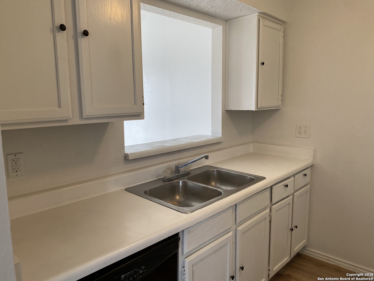 4949 Hamilton Wolfe Road, Unit 5201 San Antonio, TX 78229 - Photo 8 of 29 a kitchen with a sink and cabinets