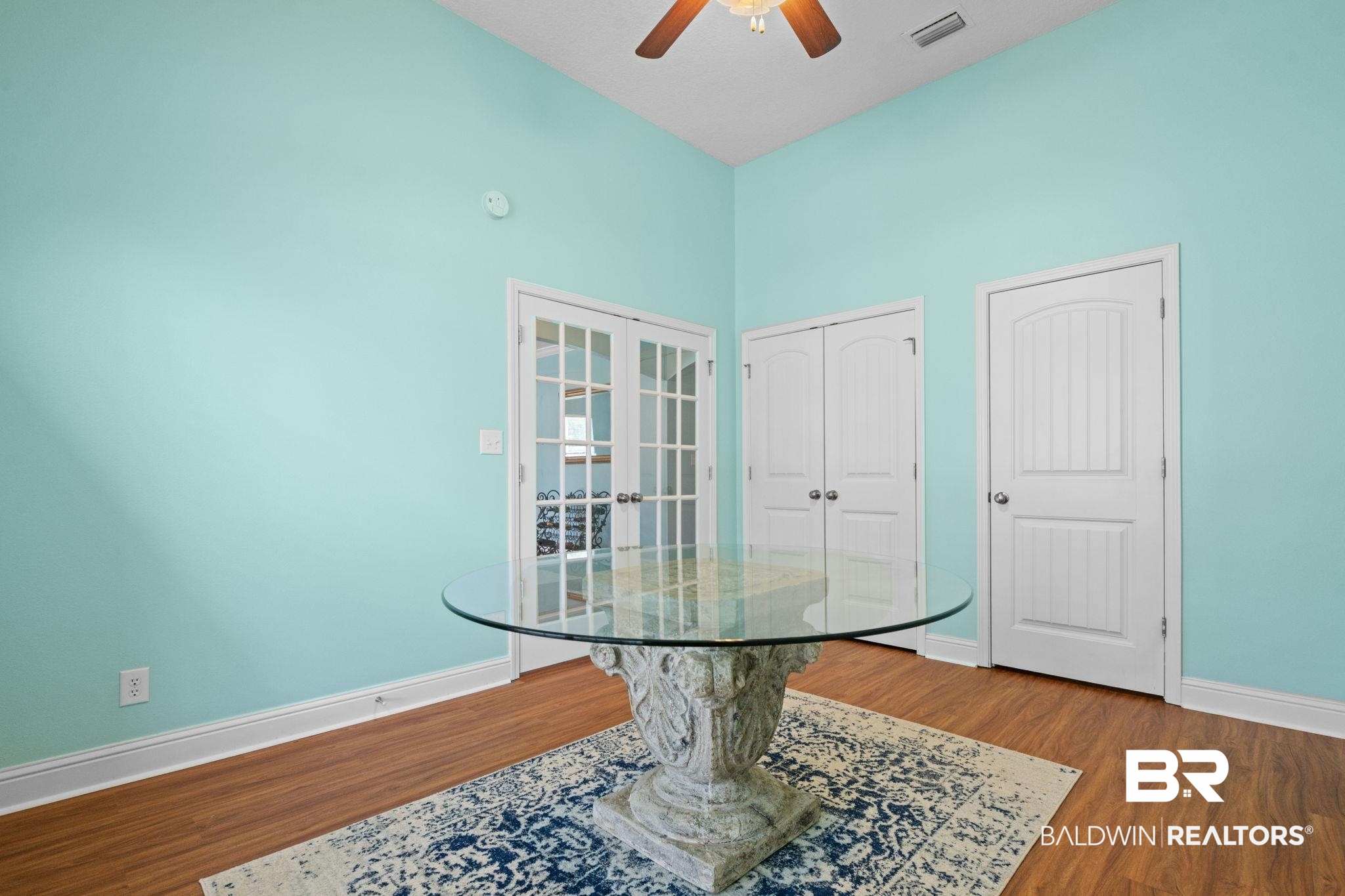 2554 Masters Court Mobile, AL 36618 - Photo 29 of 35 Dining room featuring wood finished floors, ceiling fan, and a high ceiling