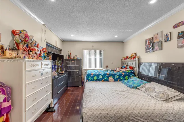 a room with furniture and a dresser