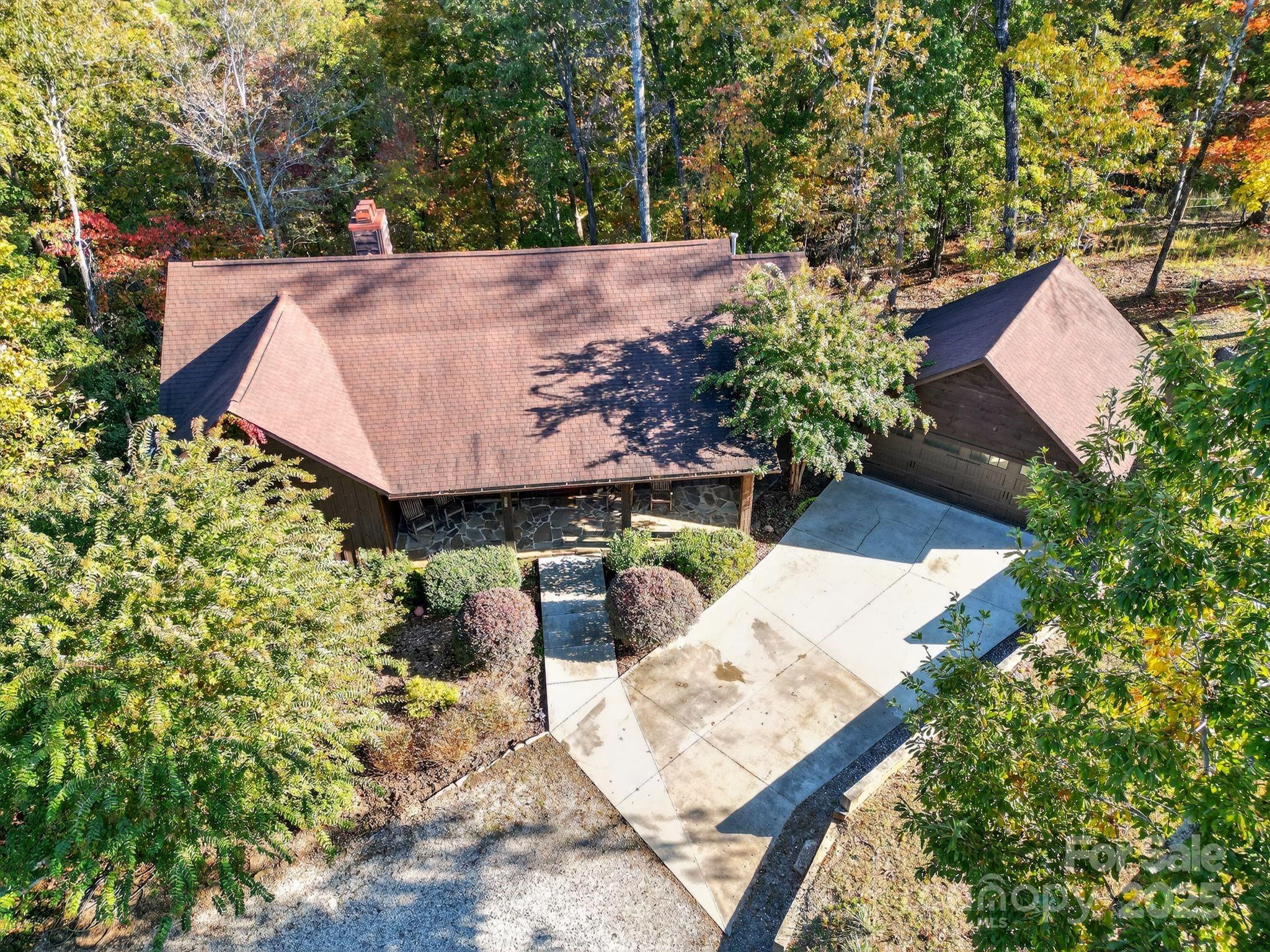 777 South River Road Tryon, NC 28782 - Photo 14 of 42 an aerial view of a house with large trees