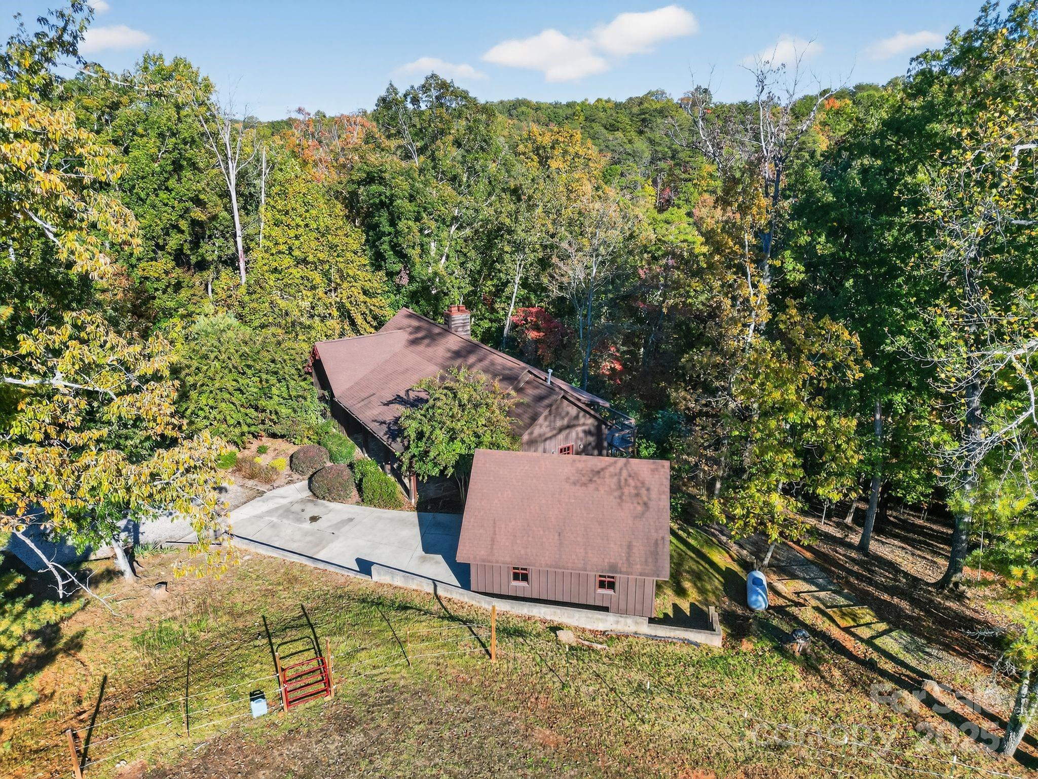 777 South River Road Tryon, NC 28782 - Photo 15 of 42 an aerial view of a house with a yard