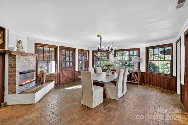 a large kitchen with a table and chairs