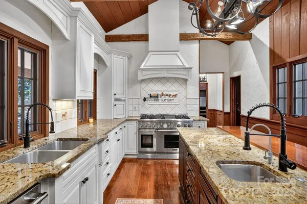 a kitchen with a stove and a sink