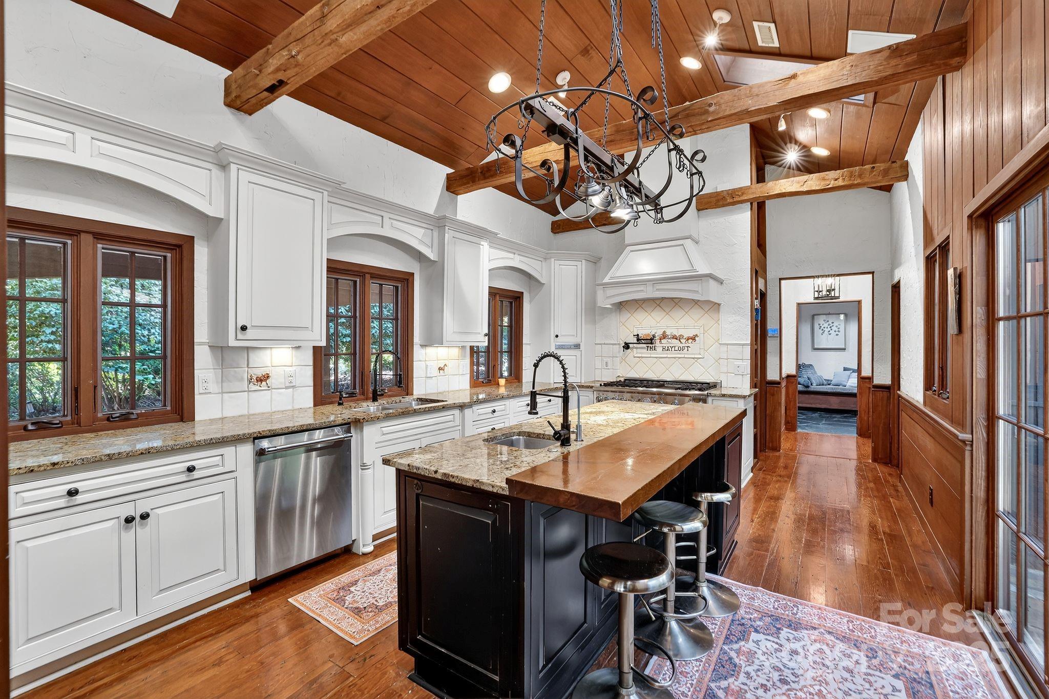 777 South River Road Tryon, NC 28782 - Photo 22 of 47 a large kitchen with a table and chairs