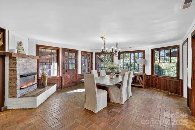a large kitchen with a table and chairs