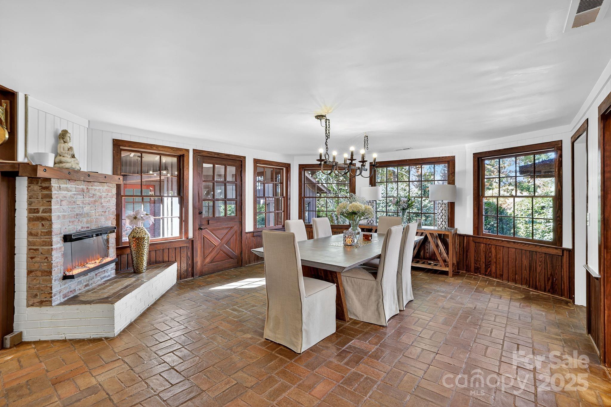 777 South River Road Tryon, NC 28782 - Photo 23 of 42 a living room with furniture and a floor to ceiling window
