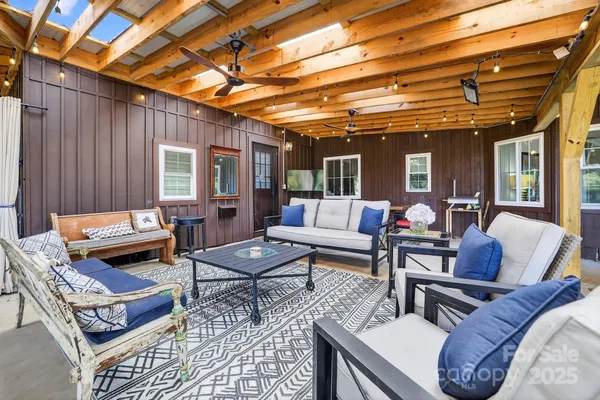 a living room filled with furniture hardwood floor and a table