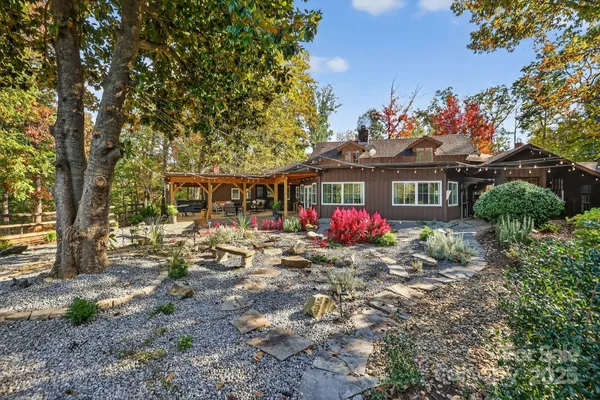 a view of a backyard with sitting area