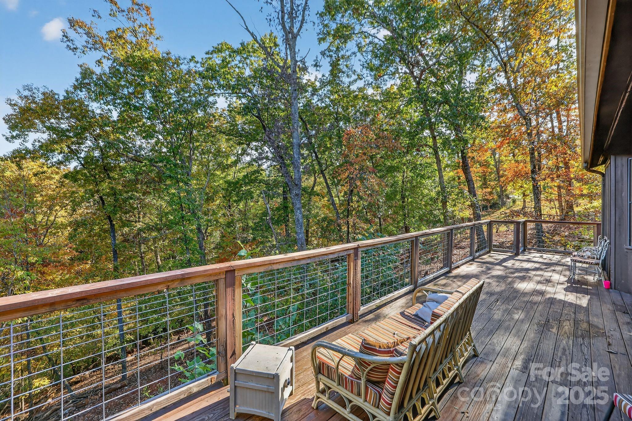 777 South River Road Tryon, NC 28782 - Photo 33 of 42 a view of a balcony with wooden floor and fence