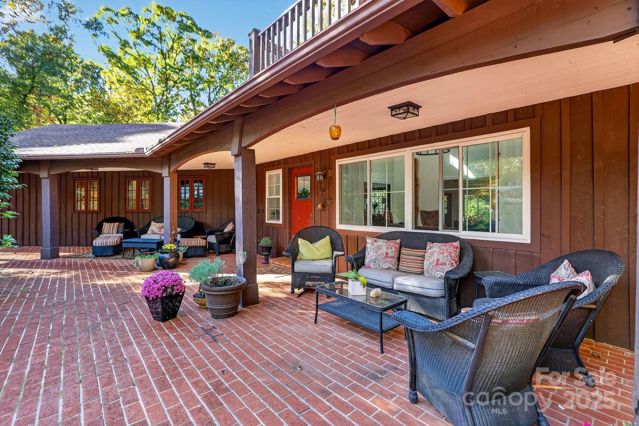 777 South River Road Tryon, NC 28782 - Photo 37 of 42 a living room filled with furniture hardwood floor and a table