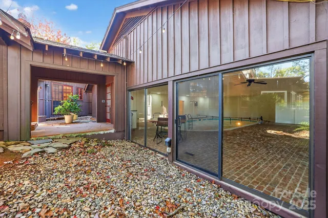 a view of white house with a yard