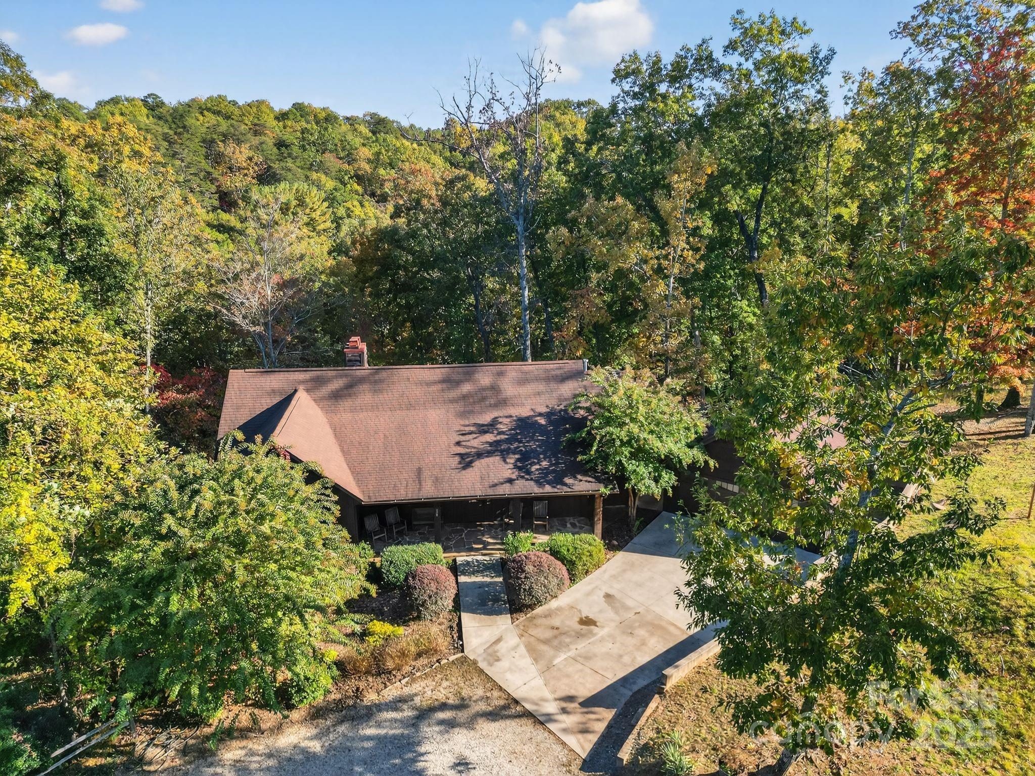 777 South River Road Tryon, NC 28782 - Photo 9 of 42 an aerial view of a house with large trees