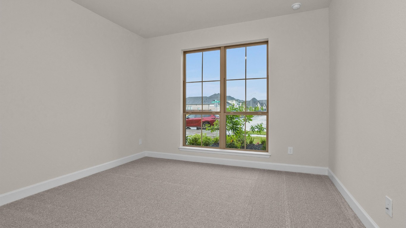 6539 Sparkling Citrus Street Manvel, TX 77578 - Photo 11 of 21 an empty room with a window