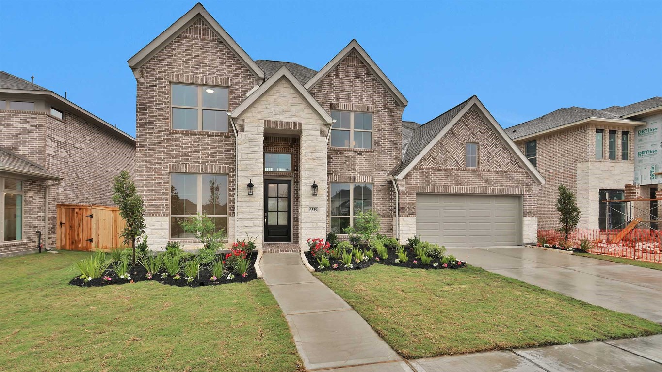 6539 Sparkling Citrus Street Manvel, TX 77578 - Photo 19 of 21 a front view of a house with a yard