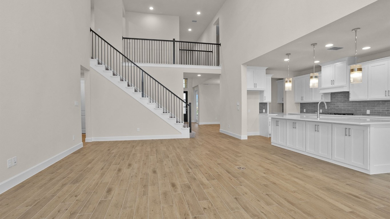 6539 Sparkling Citrus Street Manvel, TX 77578 - Photo 6 of 21 a view of staircase and kitchen with sink