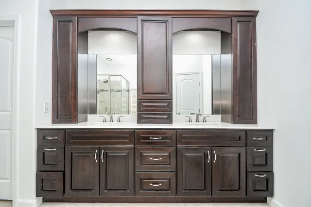 a bathroom with a sink and a mirror