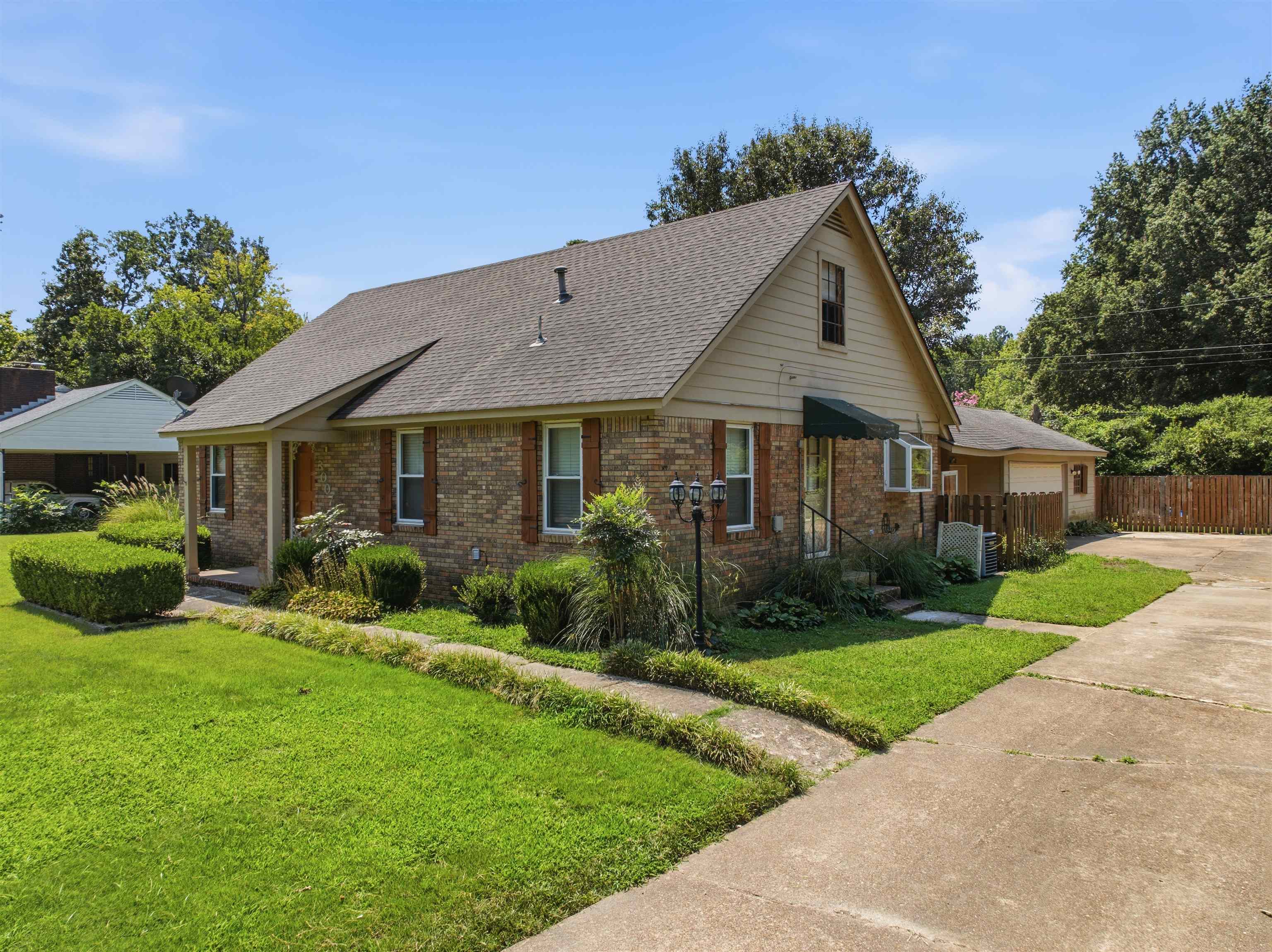 3007 Ruskin Road Bartlett, TN 38134 - Photo 1 of 37 Brick exterior featuring a gabled roofline