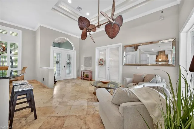 a bedroom with a large bed and a large window