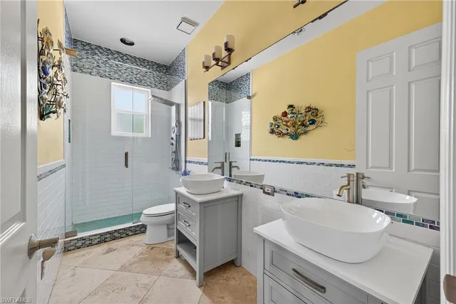 a large kitchen with a table and chairs