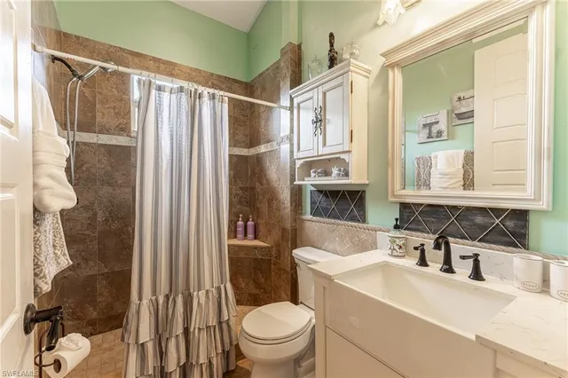 a bedroom with a bed and a flat tv screen