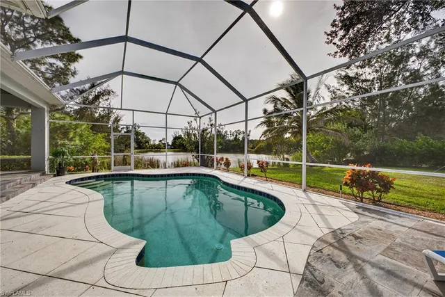a view of a swimming pool with a patio