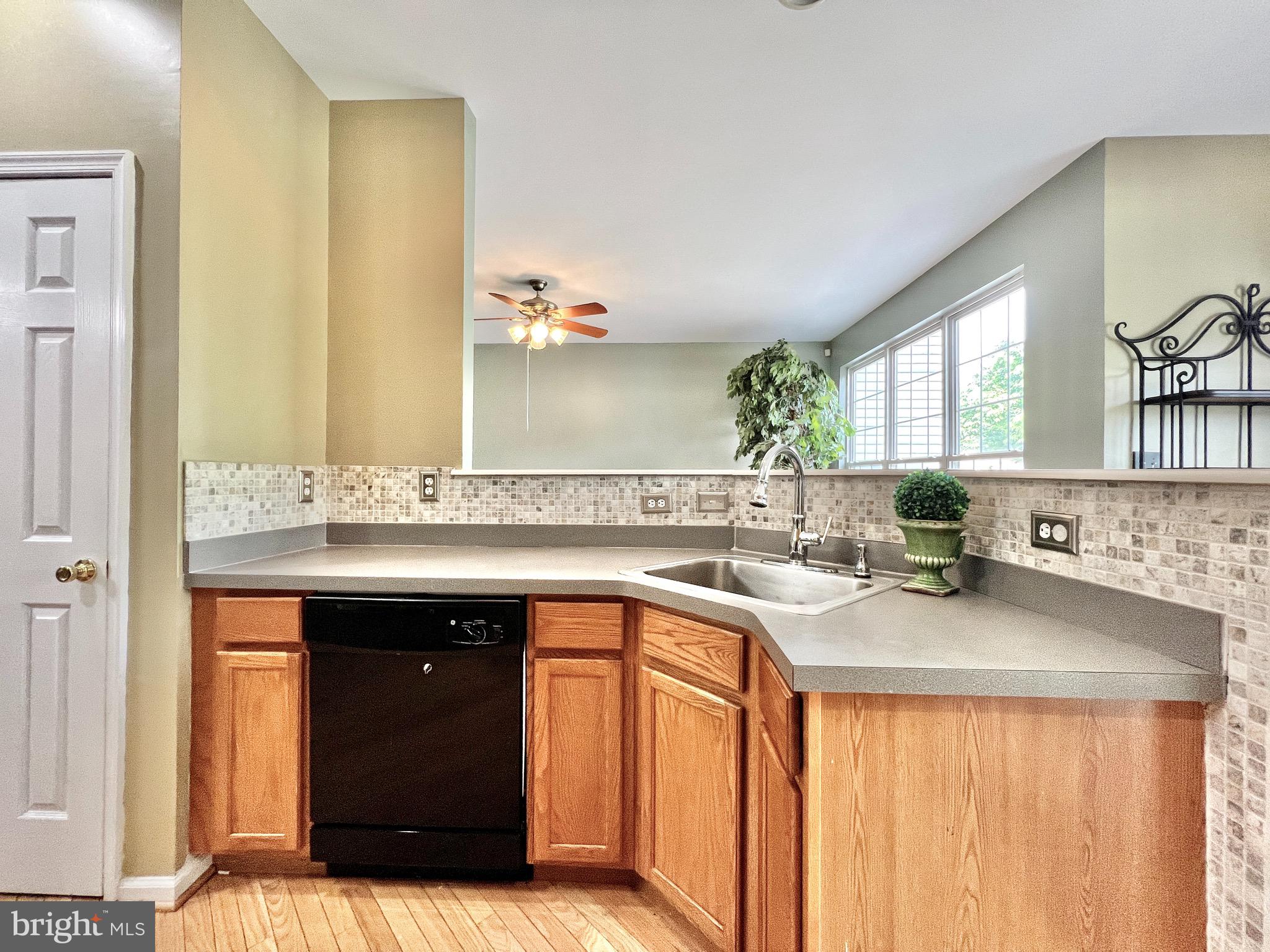 104 Threadleaf Terrace Burlington, NJ 08016 - Photo 7 of 28 Sink and prep area open to living room