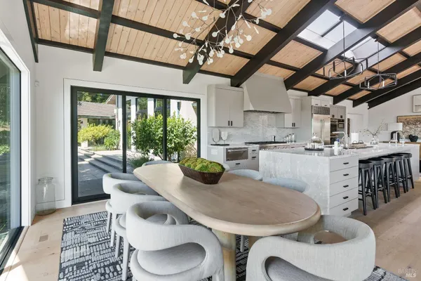 a view of a dining room with furniture window and outside view