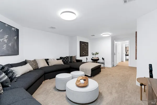 a living room with furniture and a table
